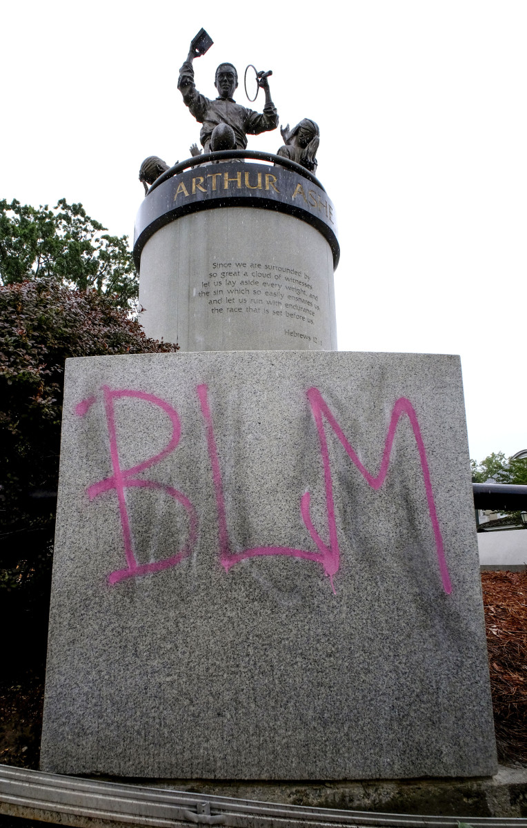 Volunteers and protesters kept Ashe's statue from being defaced with white supremacist graffiti last summer.